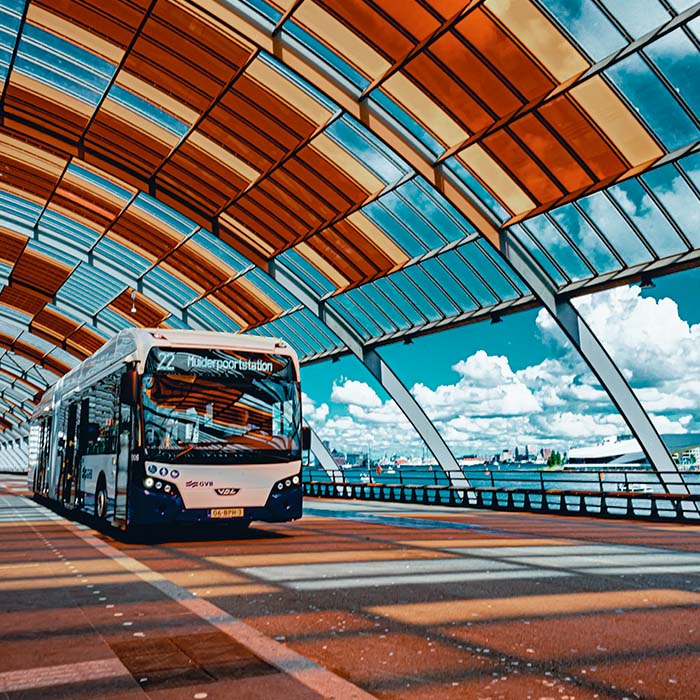 Long distance coach bus travelling along a bridge