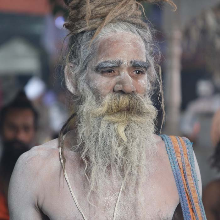 a guru with white powder on his skin