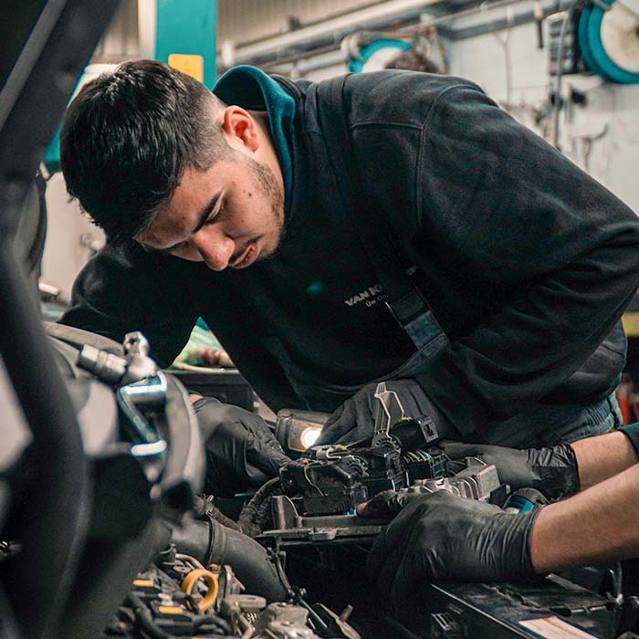a mechanic repairing a fault