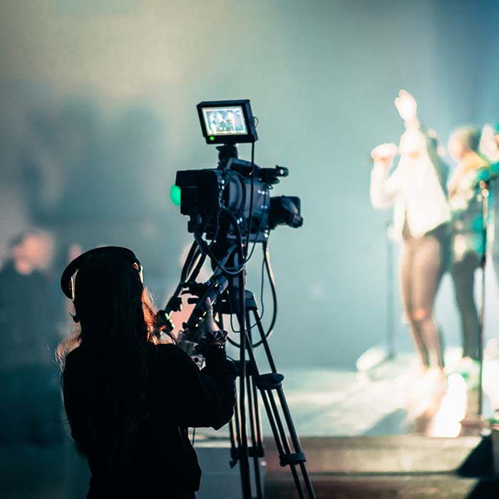 videographer shooting a concert