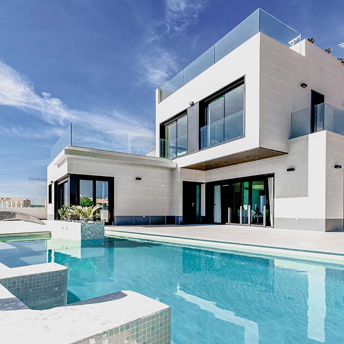 villa style house with a swimming pool